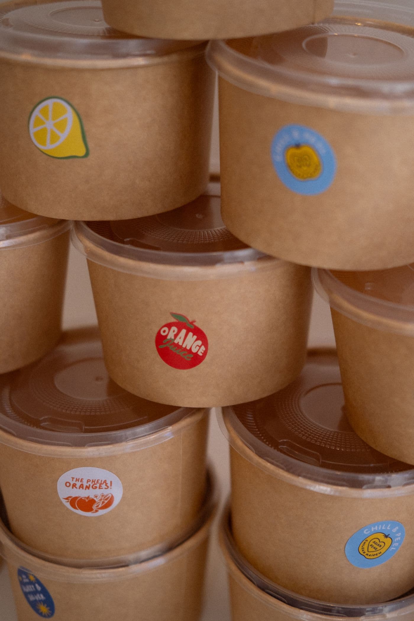 Printed self-adhesive labels applied to food packaging containers