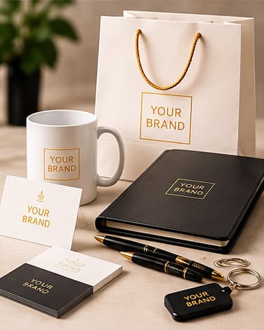 Printed promotional set — paper bag, mug, business cards, notebook and pens