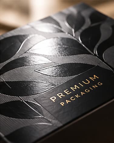 A varnished black carton with a subtle embossed sheen